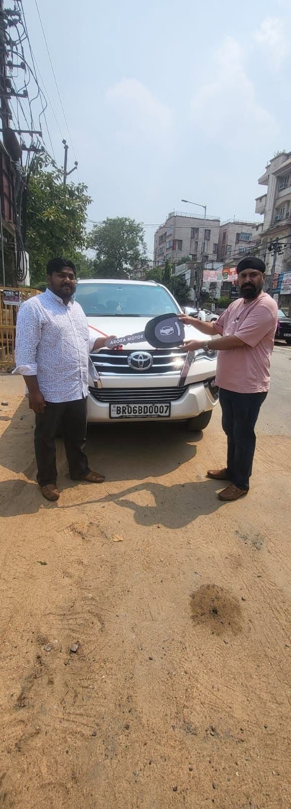 Customer taking delivery of Toyota Fortuner financed by JFS Finance