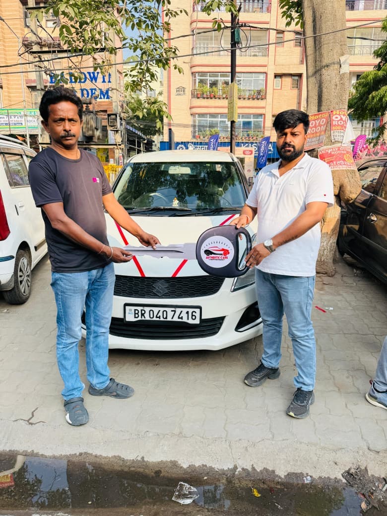 Customer taking delivery of Maruti Suzuki Swift hatchback
